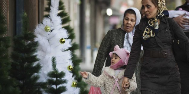 Iranian mother, daughter and some christmas trees
