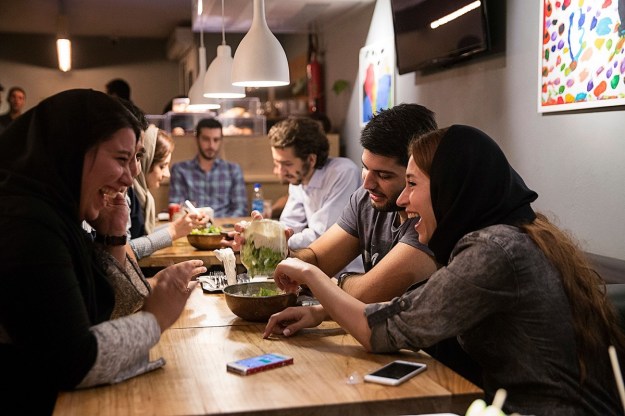 Young couples enjoy a meal in a western style restaurant in Tehran. Photographer: Simon Dawson/Bloomberg