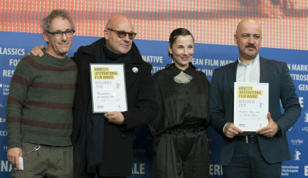 Iranian filmmaker Mehrdad Oskouei (1st R) and Italian director Gianfranco Rosi (2nd L) with Jury members Dani Levy (1st L) and Meret Becker (2nd R) in Berlin - Feb 20, 2016. Photo credits: Henning Schacht / Amnesty International